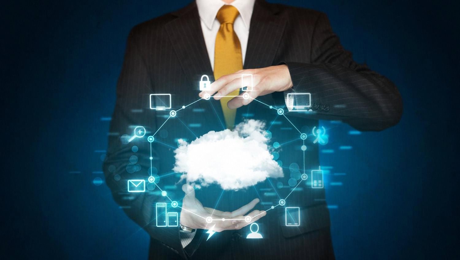 Businessman holding a cloud icon surrounded by connected IT service symbols representing cloud infrastructure in the UAE