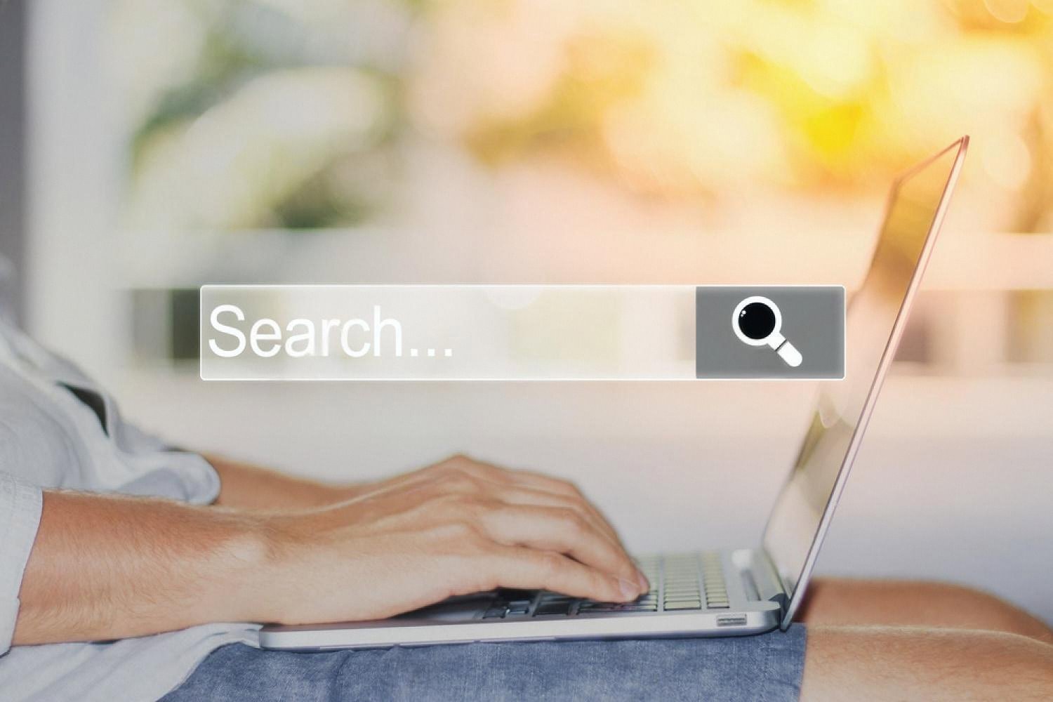 Person searching a company name in a browser search bar